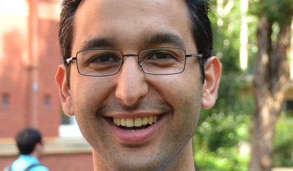 Photograph of Graduate Student Association President Sina Khatami smiling