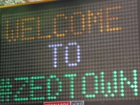 Illuminated sign saying "Welcome to #ZEDTOWN"